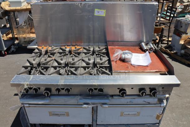 Brand new Garland G60-6G24RR 6 burner gas range with 24" griddle, 2 ovens, 310,000 BTU, minor scratches.