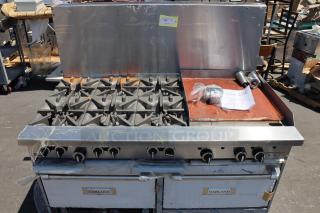 Brand new Garland G60-6G24RR 6 burner gas range with 24" griddle, 2 ovens, 310,000 BTU, minor scratches.