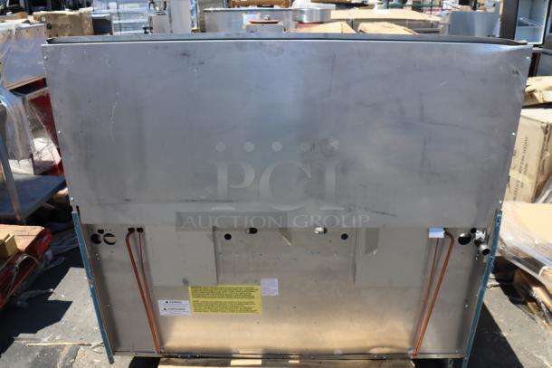 Brand new Garland G60-6G24RR range, 60", natural gas, 6 burners, 24" griddle, dual ovens. Scratch-n-dent condition.