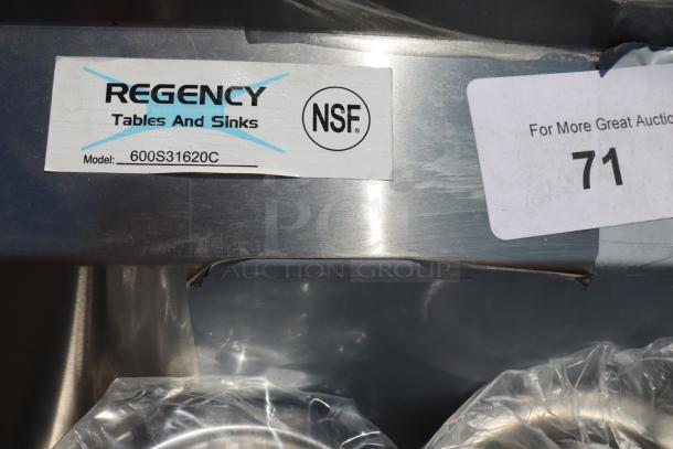 Regency 600S31620C stainless steel commercial corner sink, new, with model tag. Features: 3 compartments, 2 drainboards.