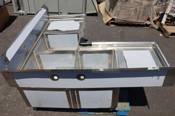 Regency 600S31620C stainless steel 3-compartment corner sink with 2 drainboards. New, minor scratches. 16"x20"x14" bowls.