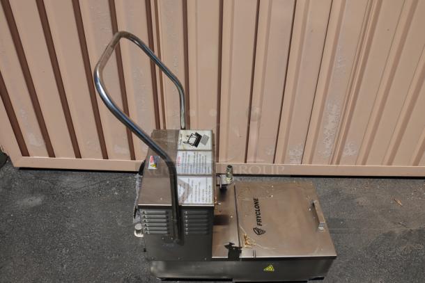 Brand new Fryclone 259OFM55 55 lb. oil filter machine with 2-way pump, visible labels, some food grade oil. Model: 259OFM55.