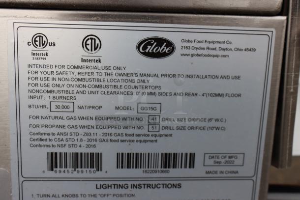Alt text: Globe GG15G 15" countertop gas griddle label; 30,000 BTU, S/N: 16220910660, commercial use only.