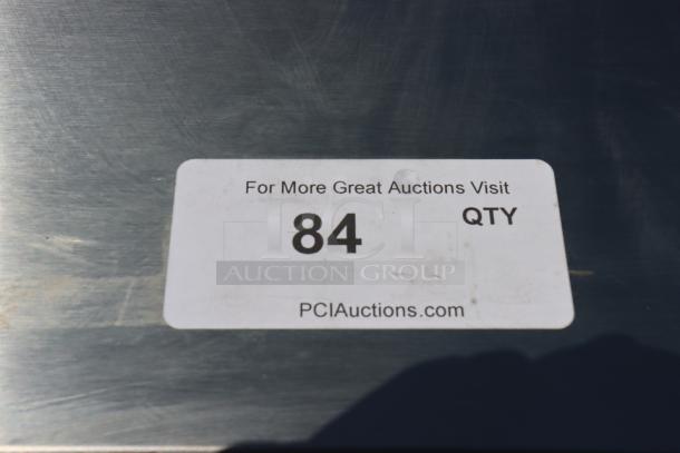 Sticker on Avantco SS-UC-48R-HC refrigerator indicates auction item number 84 with a visit to PCIAuctions.com.