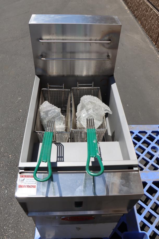 Brand new Avantco EF40-208-3 electric floor fryer, 40 lb capacity, 208V, 3 Phase. Includes baskets, green handles. Serial: 2406043205.