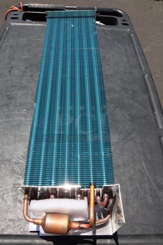 Brand new Avantco 17812873HC evaporator coil, scratch-n-dent, out of original packaging, visible copper tubing.