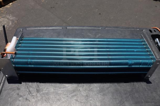 Brand new Avantco 17812873HC evaporator coil, scratch-n-dent, out of original packaging, visible coils and copper tubing.
