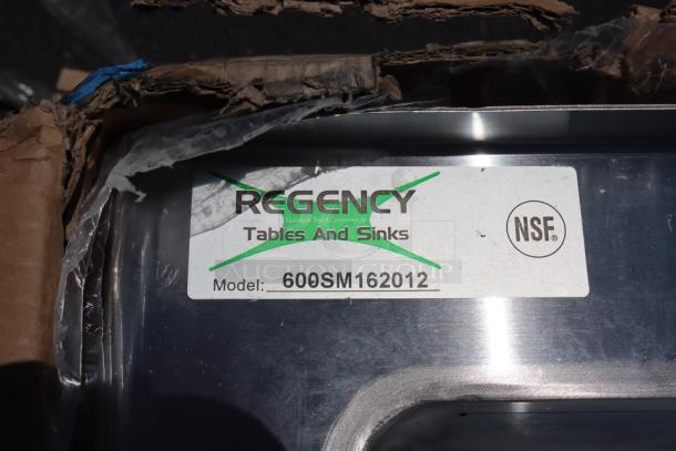 Brand new Regency 600SM162012 floor mop sink, 25" size, with NSF label. Packaging damaged; possible minor scratches/dents.