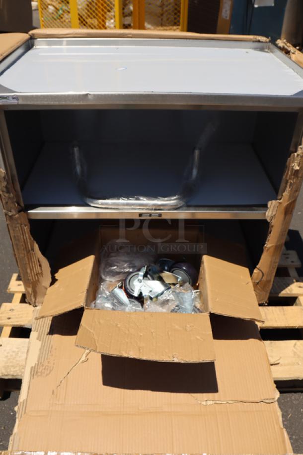 Regency 600CT3S1830E utility cart, 18" x 30", 18-gauge 304 stainless steel, three shelves, enclosed base, open front. Packaging damaged.