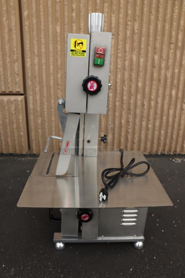 Brand new Avantco EMBS65SS 65" stainless steel vertical band meat saw, 1 hp, 120V, with visible labels and controls.