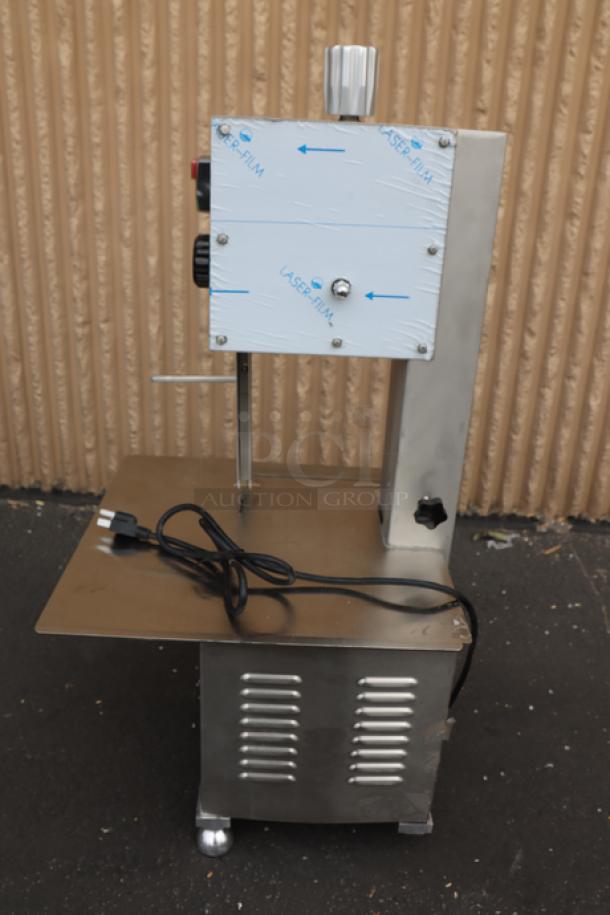 Avantco EMBS65SS 65" stainless steel countertop vertical band meat saw, new condition, includes power cord, model number visible.