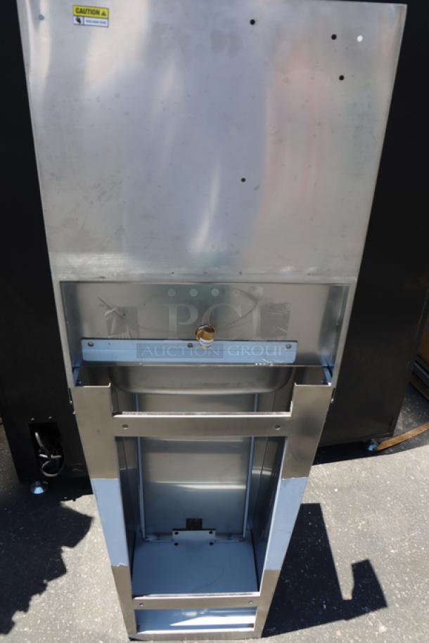 Brand new Regency 600HS17FPB hands-free hand sink with pedestal base, stainless steel, minor dents visible.