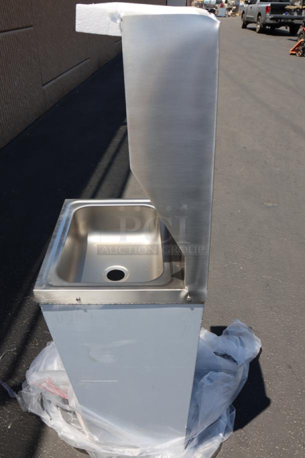 Brand new Regency hands-free hand sink, model 600HS17FPB, with pedestal base. Top left corner is bent.