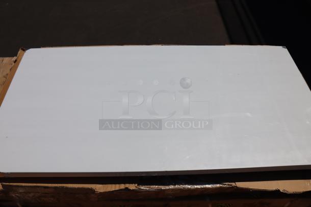 Regency 600T3080G 30" x 30" stainless steel work table, minor scratches and dents, damaged packaging visible.