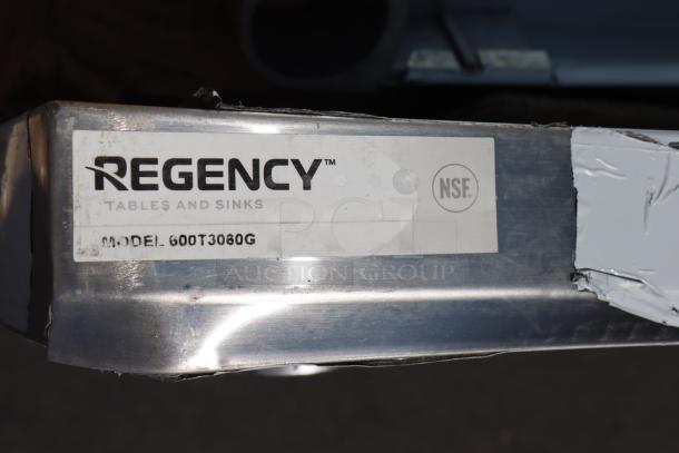 Regency 600T3080G 30"x30" stainless steel work table, 18-gauge, with galvanized legs. Minor scratches and dents. Damaged packaging.