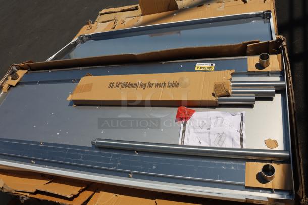 Regency 600T9B30723 stainless steel poly top table with undershelf shown in damaged packaging. Some scratching and denting visible.