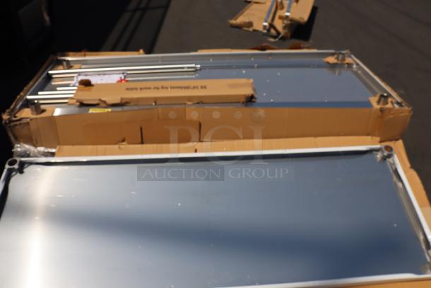 Brand new Regency 600T9B30723 stainless steel table, 30"x72", with poly top, undershelf, and 6" backsplash. Original packaging damaged.