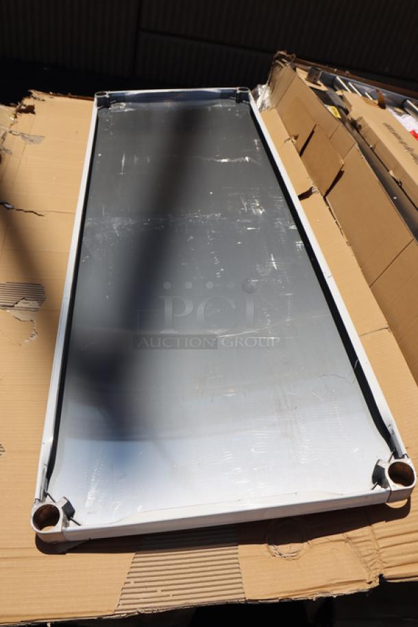 Regency 600T9B30723 stainless steel table with 3/4" poly top, undershelf, and 6" backsplash. New, may have scratches/dents.