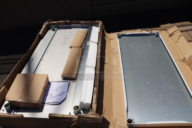 Regency 30" x 60" stainless steel equipment stand, model 600ES3060GK, with galvanized undershelf and casters. Packaging damaged.