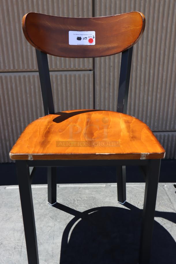 BRAND NEW Lancaster Table & Seating boomerang style chair, metal frame, wood seat, out of packaging, with auction label.