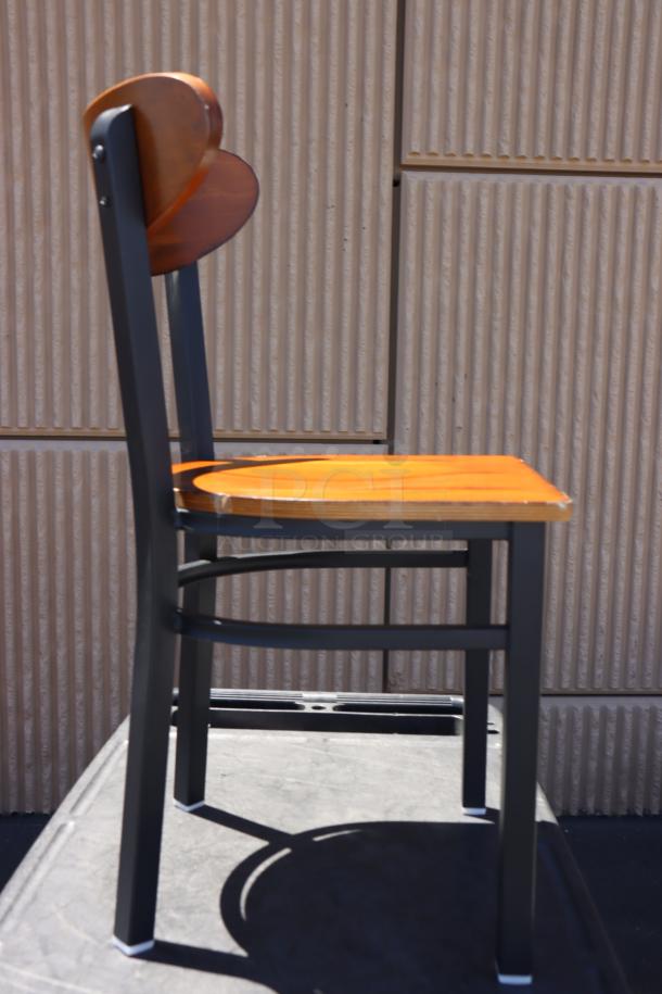 Brand new Lancaster Table & Seating boomerang-style metal chair with wood seat, no packaging, excellent condition.