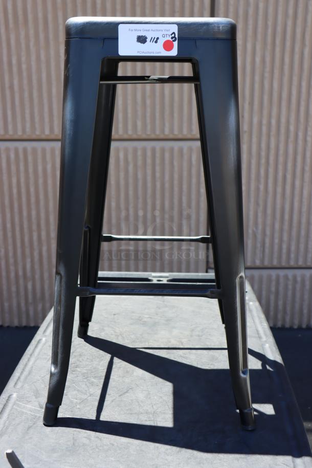 Lancaster Table & Seating metal bar stool, black, sturdy design. Auction label shows quantity of three.