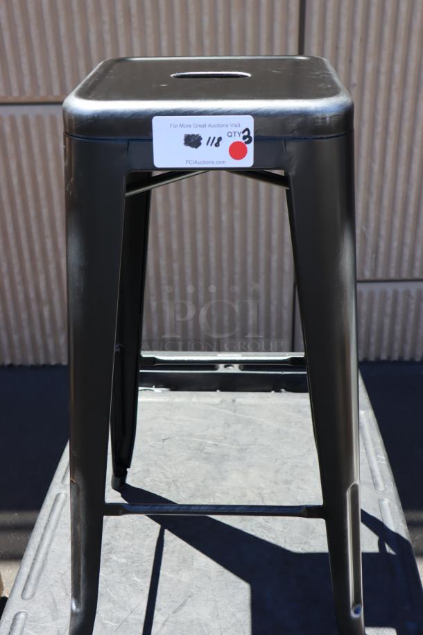 Lancaster Table & Seating metal bar stool, durable black finish, visible auction tag indicating quantity of 3.