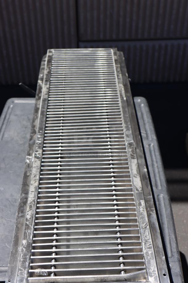 BRAND NEW Regency 600FT1248SS 12"x48" stainless steel floor trough with grate, 14-gauge, visible scratches.