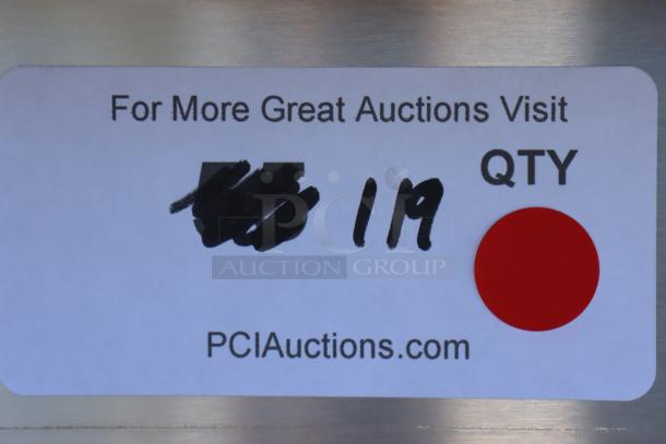 Sticker on stainless steel item with text: “For More Great Auctions Visit PCIAuctions.com.” Quantity marked as 119, red circle present.