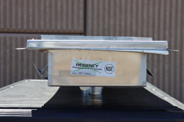 Brand new Regency 600FT1248SS 12"x48" stainless steel floor trough with grate. Scratch-n-dent condition. NSF labeled.