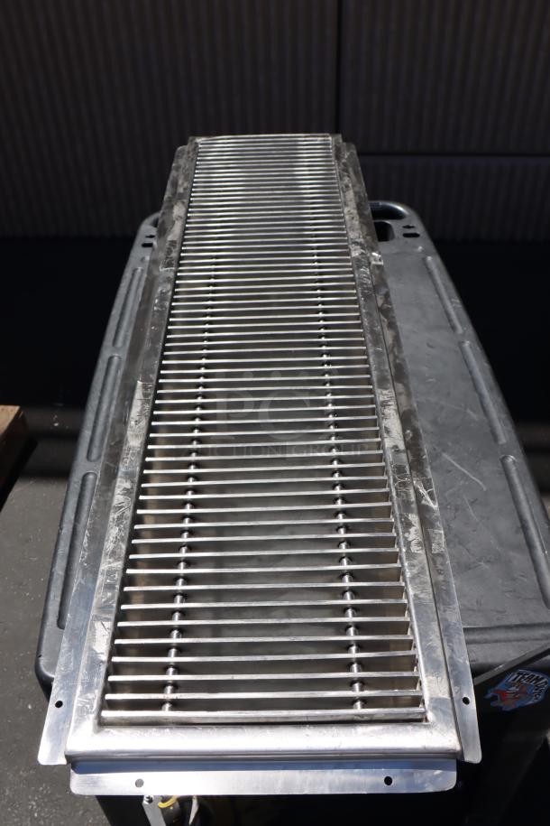 Brand new Regency 600FT1248SS 12"x48" stainless steel floor trough with grate, slight scratches, 14-gauge steel.