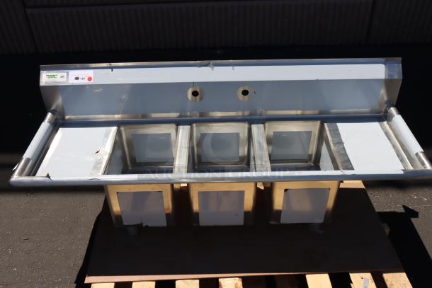 Brand new Regency 58" stainless steel sink, model 600S31014212, with 3 compartments and 2 drainboards. Scratch-n-dent.