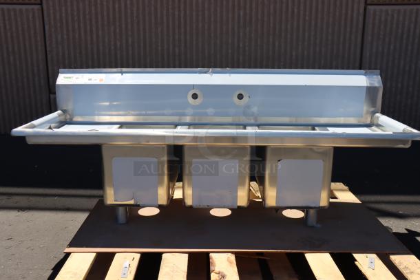 Brand new Regency 58" three-compartment stainless steel sink, model 600S31014212, with galvanized steel legs, two drainboards.