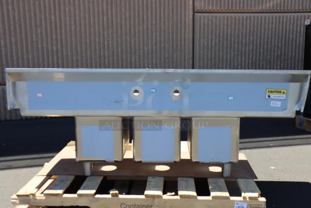 Brand new Regency 58" stainless steel 3-compartment sink with galvanized legs and 2 drainboards. Model 600S31014212.
