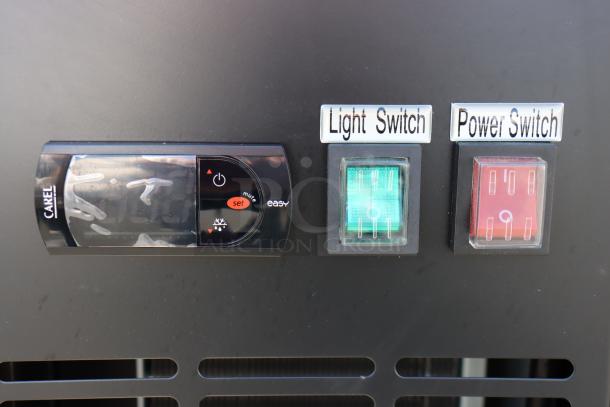 Avantco UBB-48G-HC refrigerator controls with Carel display, labeled light and power switches, auction item.