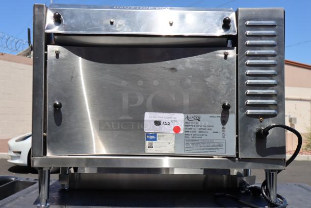 Brand new Avantco BT18A vertical contact conveyor bun toaster, 120V, 1600W. Visible labels with model and serial number.