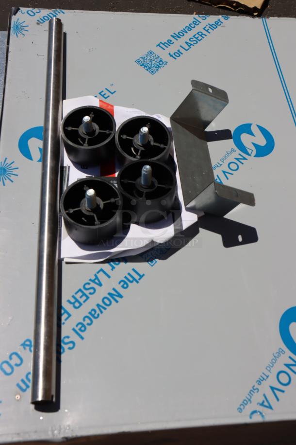 Replacement parts for Cooking Performance Group COH-D4-M convection oven, including legs and mounting bracket on protective wrap.