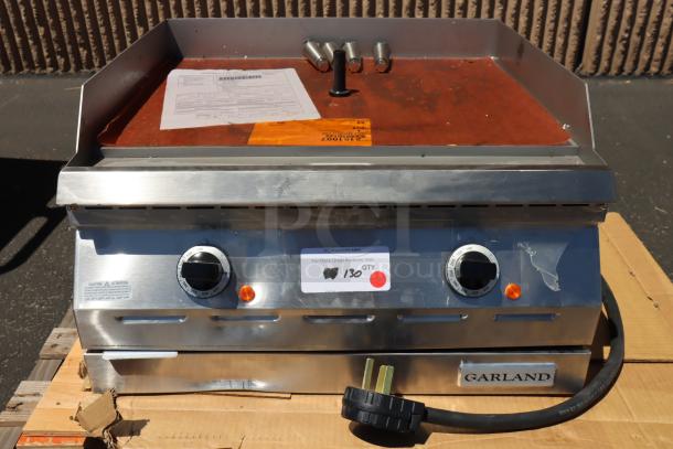 Garland ED-24G electric countertop griddle, 24", 208V, 1 phase, 6.7 kW, new, broken leg mounts, visible paperwork and label.