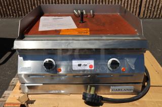 Garland ED-24G electric countertop griddle, 24", 208V, 1 phase, 6.7 kW, new, broken leg mounts, visible paperwork and label.