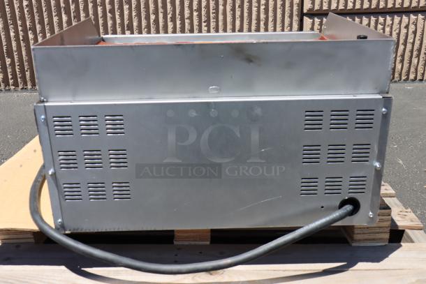 Brand new Garland ED-24G 24" electric countertop griddle, 208V, 6.7 kW. Scratch-n-dent with broken leg mount welds.