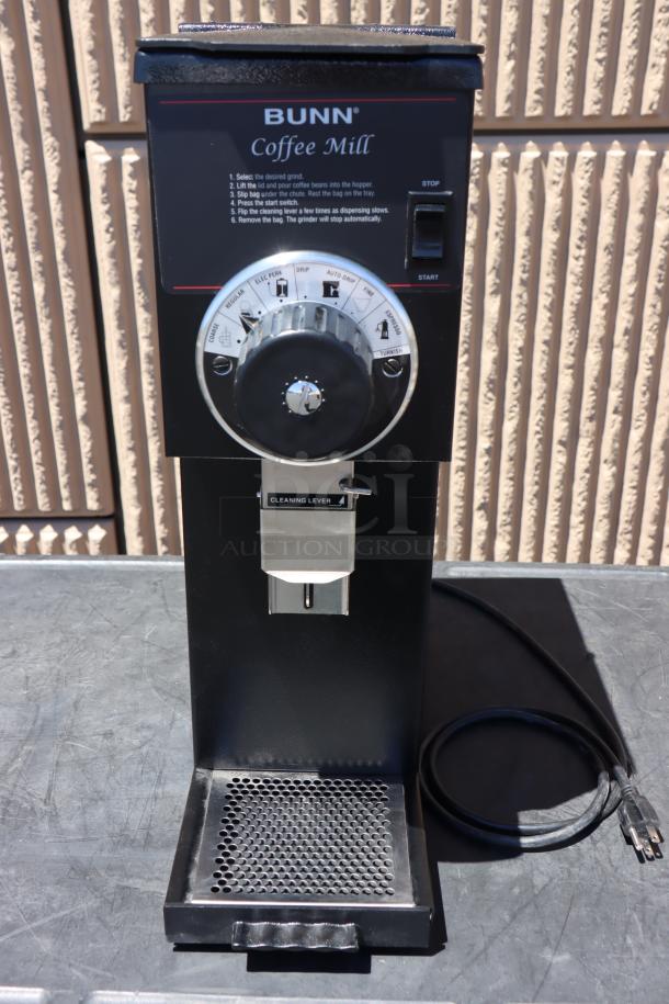 Brand new Bunn 22104.0000 G1 HD 1 lb. black bulk coffee grinder, 120v. Visible grind settings and cleaning lever.