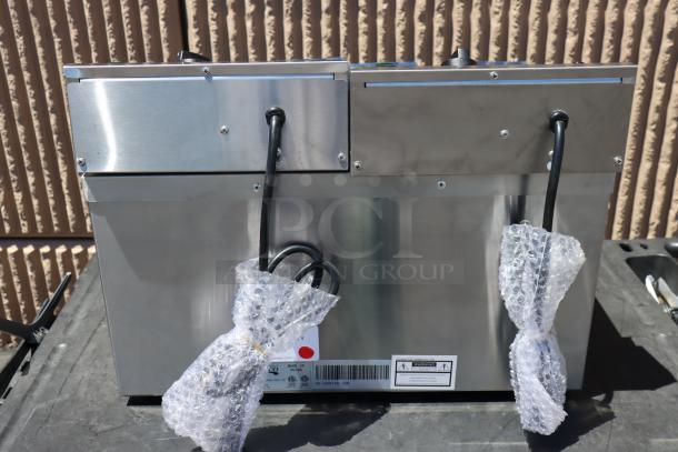 Avantco F202 30 lb. Dual Tank Electric Fryer, 5400/7200W, out of packaging, with cords wrapped in bubble wrap.