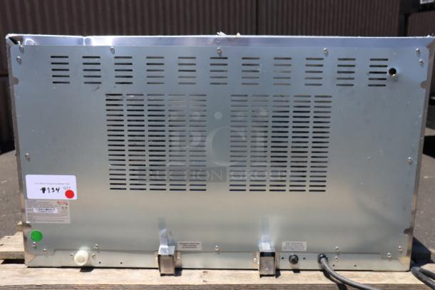 Alt text: Back view of Avantco CO-46M full-size countertop convection oven. Visible vents and labels with S/N: CO46MB23120030.