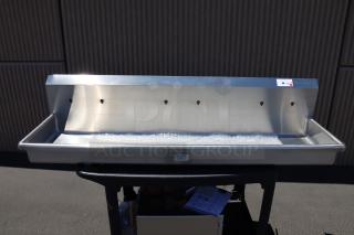 Sani-Lav 5A3F-0.5 wall-mounted hand sink, 68" x 20", with three faucets. New, potential scratches/dents; damaged packaging.