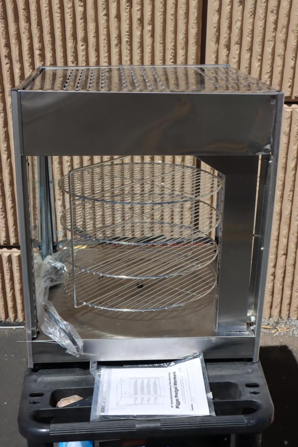 BRAND NEW ServIt PDW18D1P pizza warmer with rotating 4-shelf rack and pretzel rack. Glass pane is broken. SERIAL #: 1457301300066.
