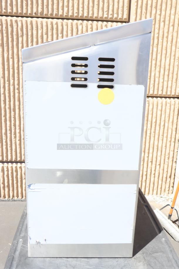 Brand new Regency 600WCS1524 24" stainless steel wall cabinet with sliding doors, minor scratches, yellow sticker marked.