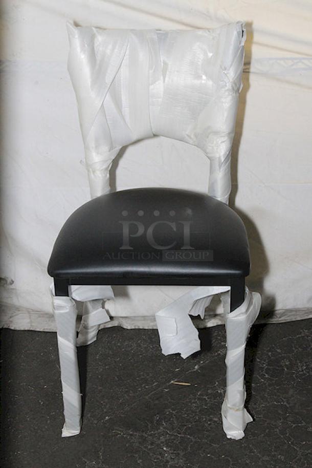 Brand new Lancaster Table & Seating chair, wrapped in protective packaging. Black seat, sturdy design, pristine condition.