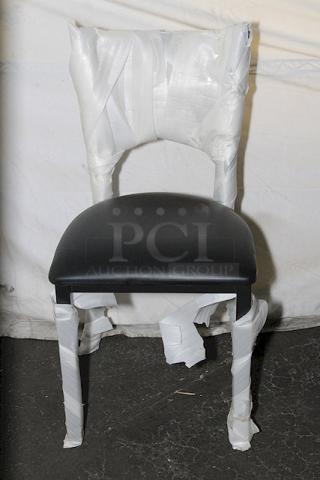 Brand new Lancaster Table & Seating chair, wrapped in protective packaging. Black seat, sturdy design, pristine condition.
