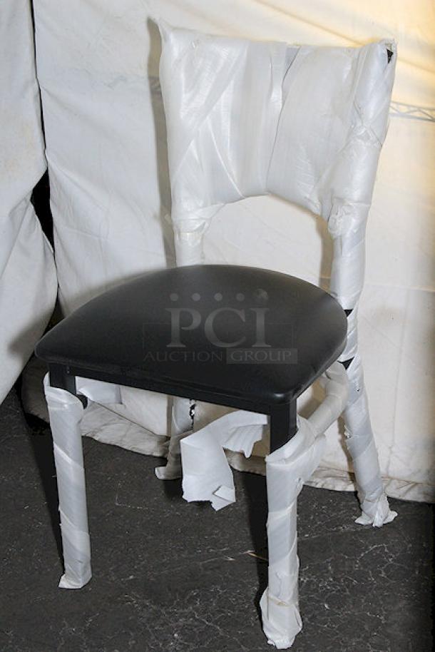 Brand new Lancaster Table & Seating chair wrapped in packaging. Set of 20 chairs, unused, in box. Durable frame, sleek seat.