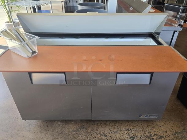 LIKE NEW!! True TSSU-72-18 72 3/8" 3 Door Refrigerated Sandwich Prep Table	On Commercial Casters, 115 Volts	7.2 Amps	1 Phase!! IN PERFECT WORKING ORDER!! S/N: 3752038 - Image 2 of 3